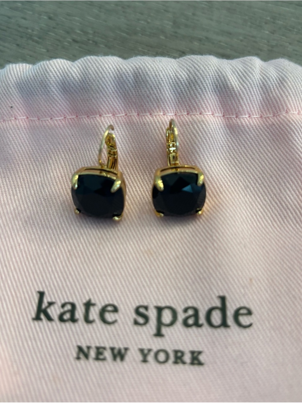 Earrings on Kate Spade pouch